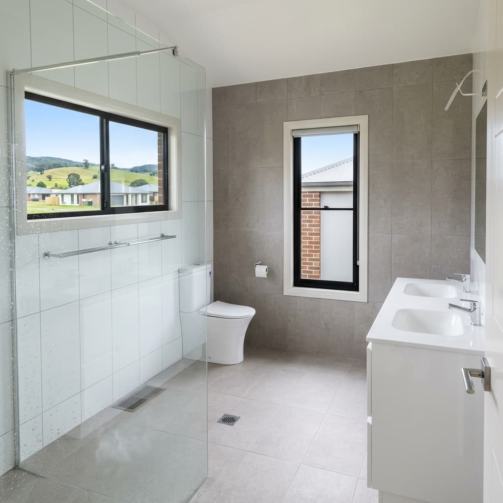 Spacious Ensuite with Glass Shower & Grey Feature Wall